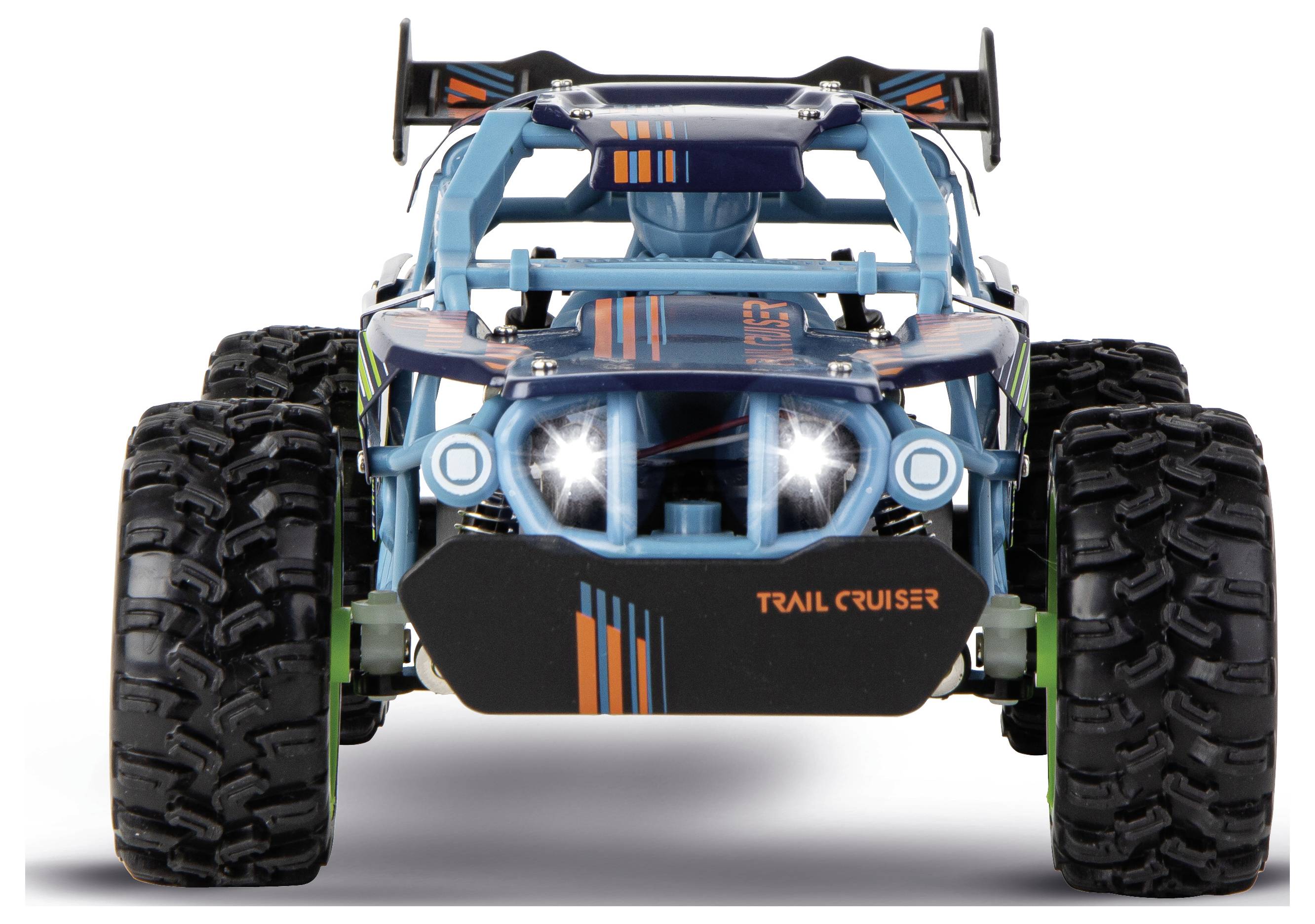 Vue de face d'un camion tout-terrain radiocommandé bleu et noir avec des pneus surdimensionnés et des phares, étiqueté « TRAIL CRUISER ».