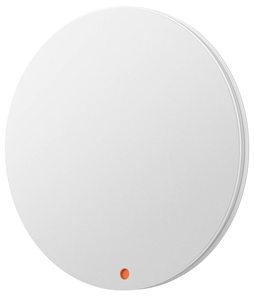 Appareil circulaire blanc fixé au mur avec un petit voyant indicateur orange près du bas.
