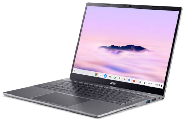 Ordinateur portable Acer argenté ouvert sur un fond blanc, affichant un écran de bureau rose pastel et violet avec des icônes d'applications sur la barre des tâches.