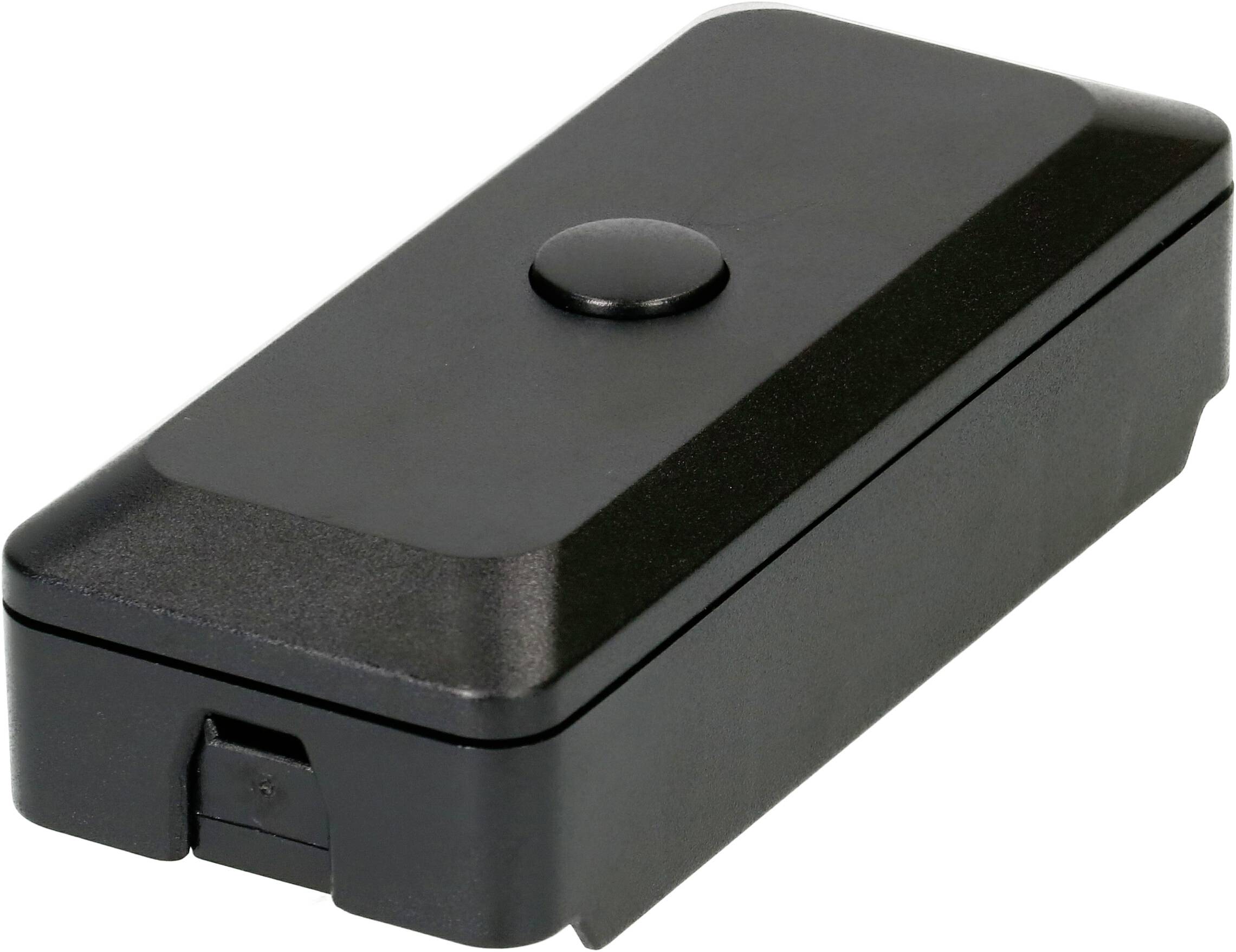 Module électronique en plastique noir de forme rectangulaire avec un seul bouton rond sur le dessus et une petite ouverture de connecteur à une extrémité.