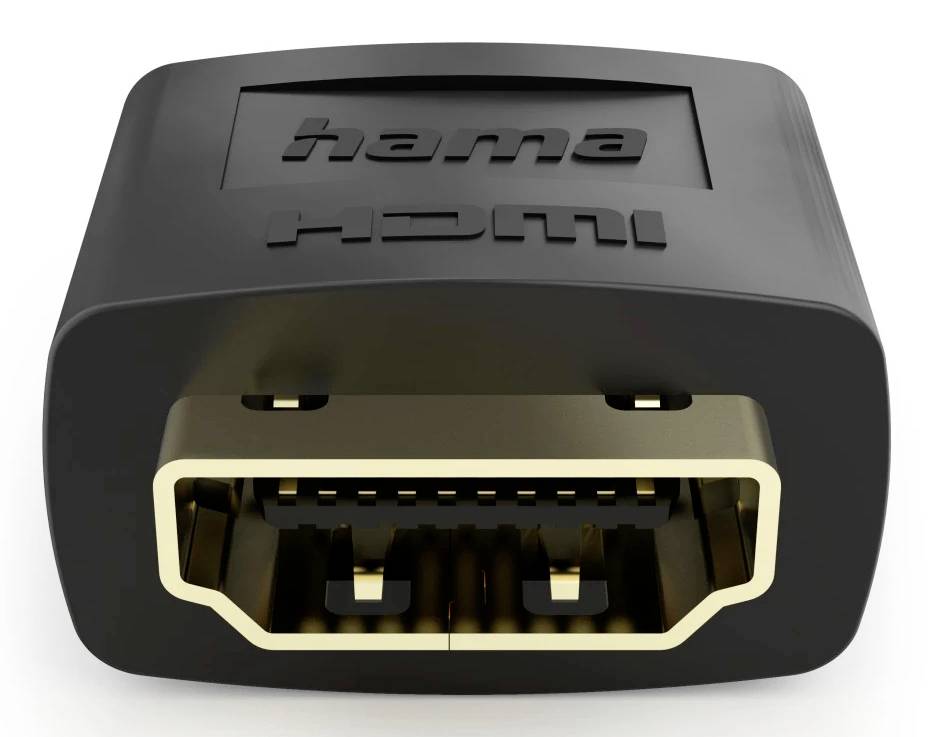 Gros plan d'un adaptateur HDMI portant les étiquettes 'hama' et 'HDMI', montrant le port HDMI femelle sur un connecteur noir.