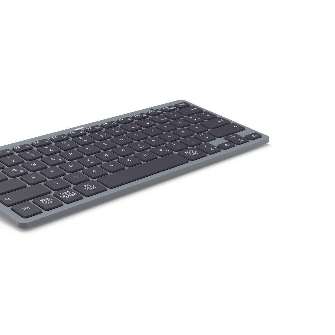 Clavier sans fil gris foncé élancé présenté sous un angle sur un fond blanc uni.