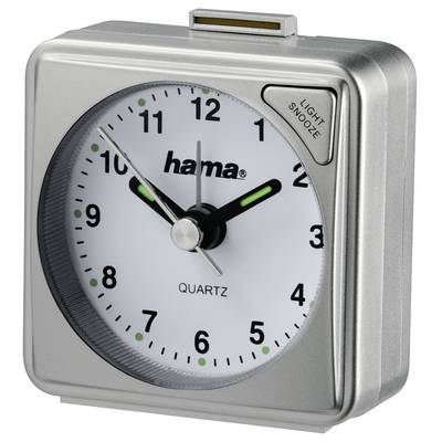 Réveil analogique argenté avec cadran blanc, aiguilles et chiffres noirs, affichant l'heure autour de 10h10, avec un bouton « LIGHT SNOOZE » en haut à droite.