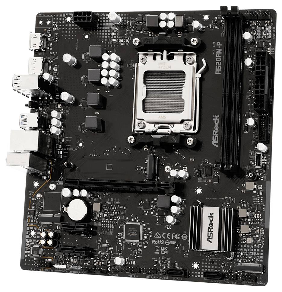 Carte mère informatique avec socket processeur AMD Ryzen, emplacements RAM, emplacements PCIe et ports d'E/S arrière, vue de dessus.