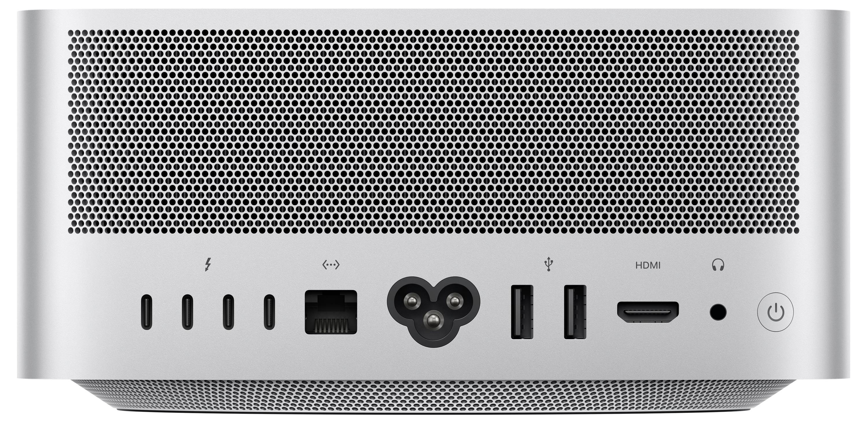 Vue arrière d'un ordinateur de bureau argenté montrant les grilles de ventilation et les ports, y compris USB, Ethernet, alimentation, HDMI et prise casque.