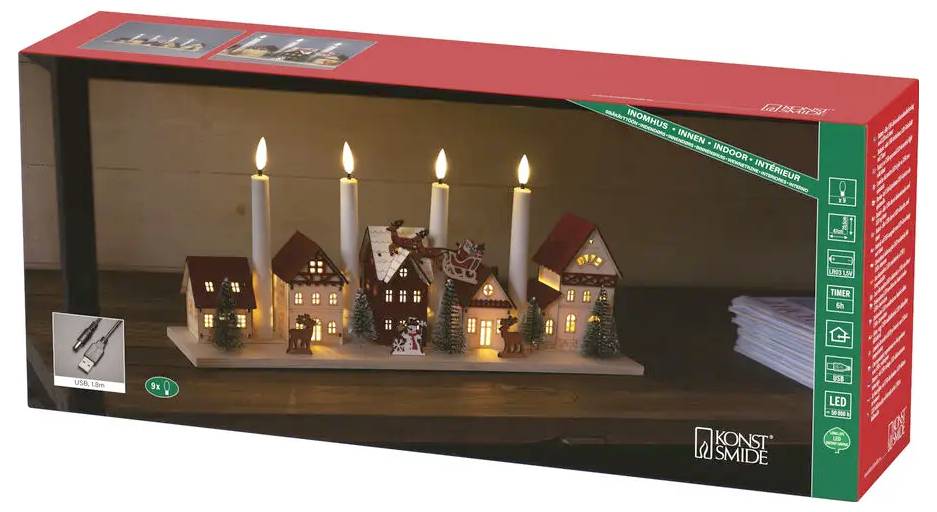 Affichage de village de Noël LED en boîte avec maisons miniatures illuminées, arbres et bougies à l'intérieur d'un ensemble à thème festif.