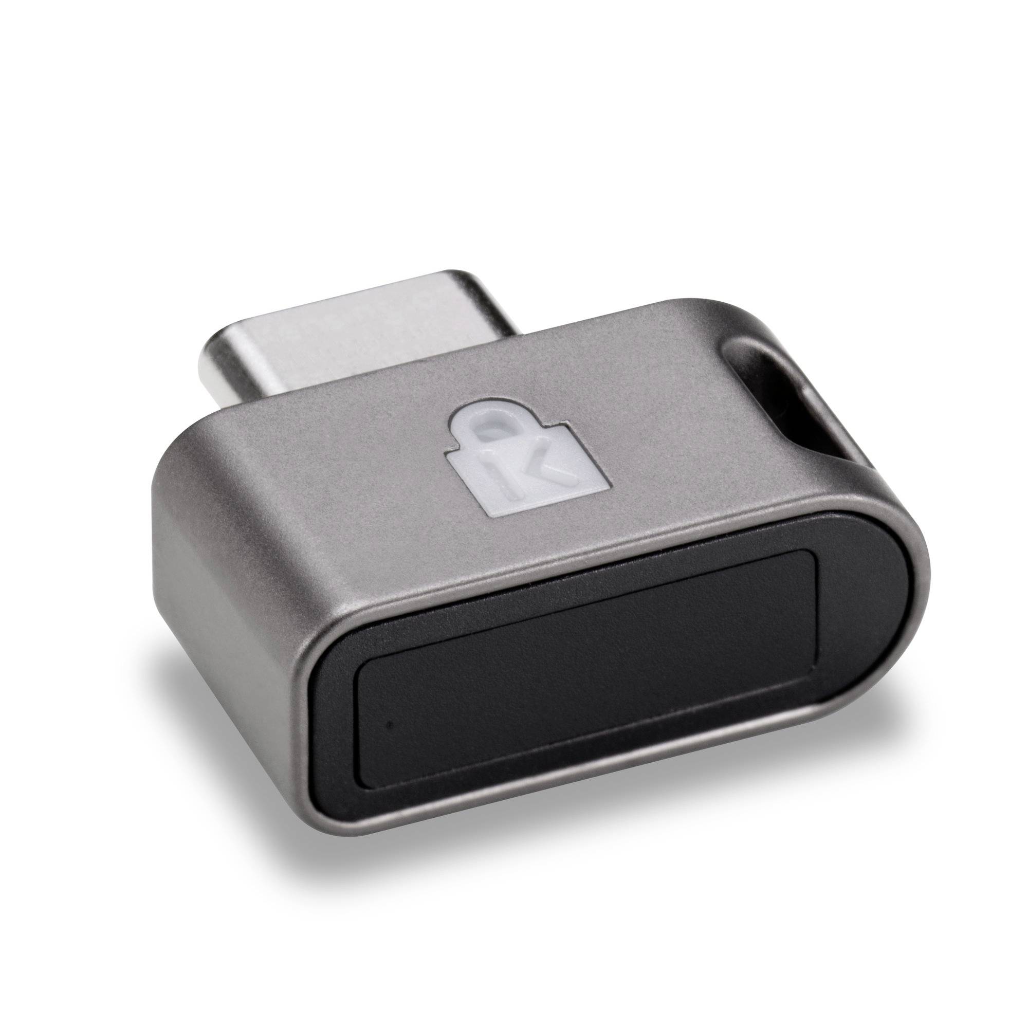 Petit adaptateur USB-C avec une icône de cadenas sur le dessus, présenté isolé sur un fond blanc.