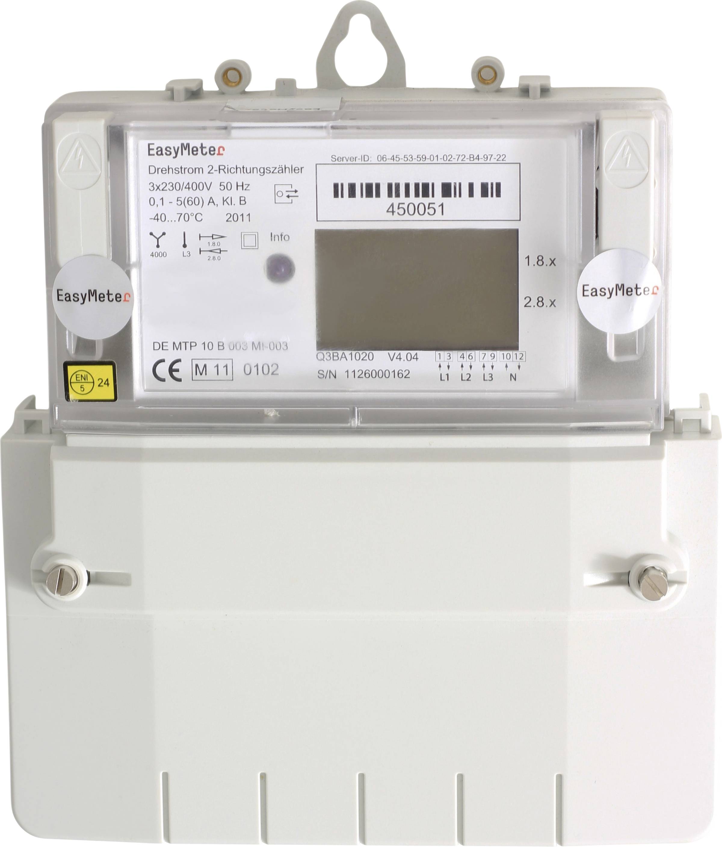 Compteur électrique avec affichage, code-barres et étiquettes techniques dans un boîtier de protection transparent.