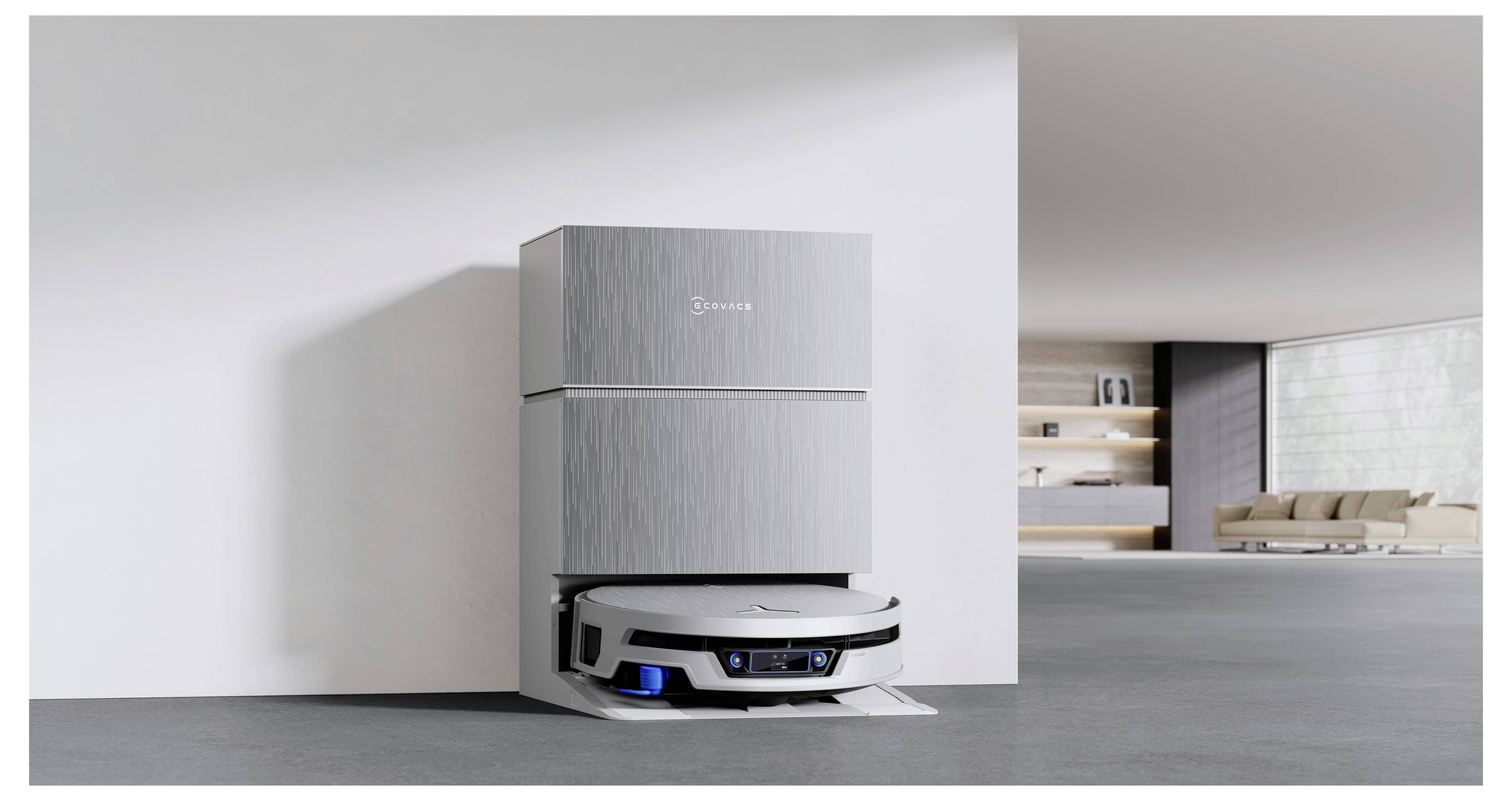 Un robot aspirateur amarré à une station de recharge à côté d'un grand appareil blanc dans une pièce minimaliste et moderne.