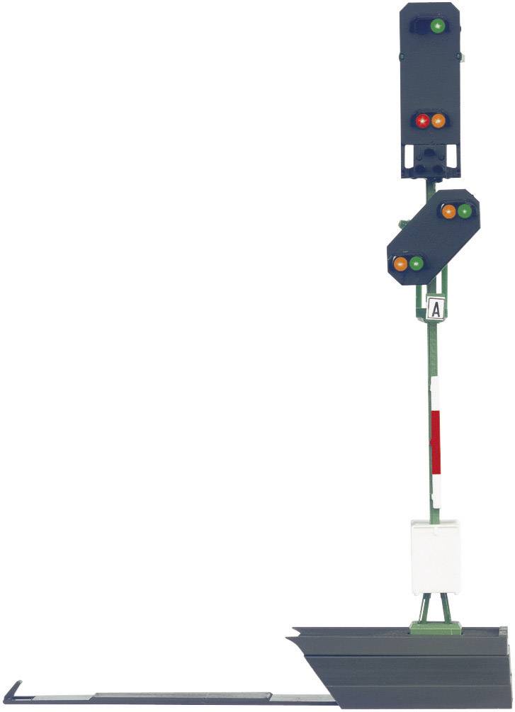 Un signal ferroviaire affiche deux lumières vertes et une lumière orange. Il signale différents états pour le trafic ferroviaire.