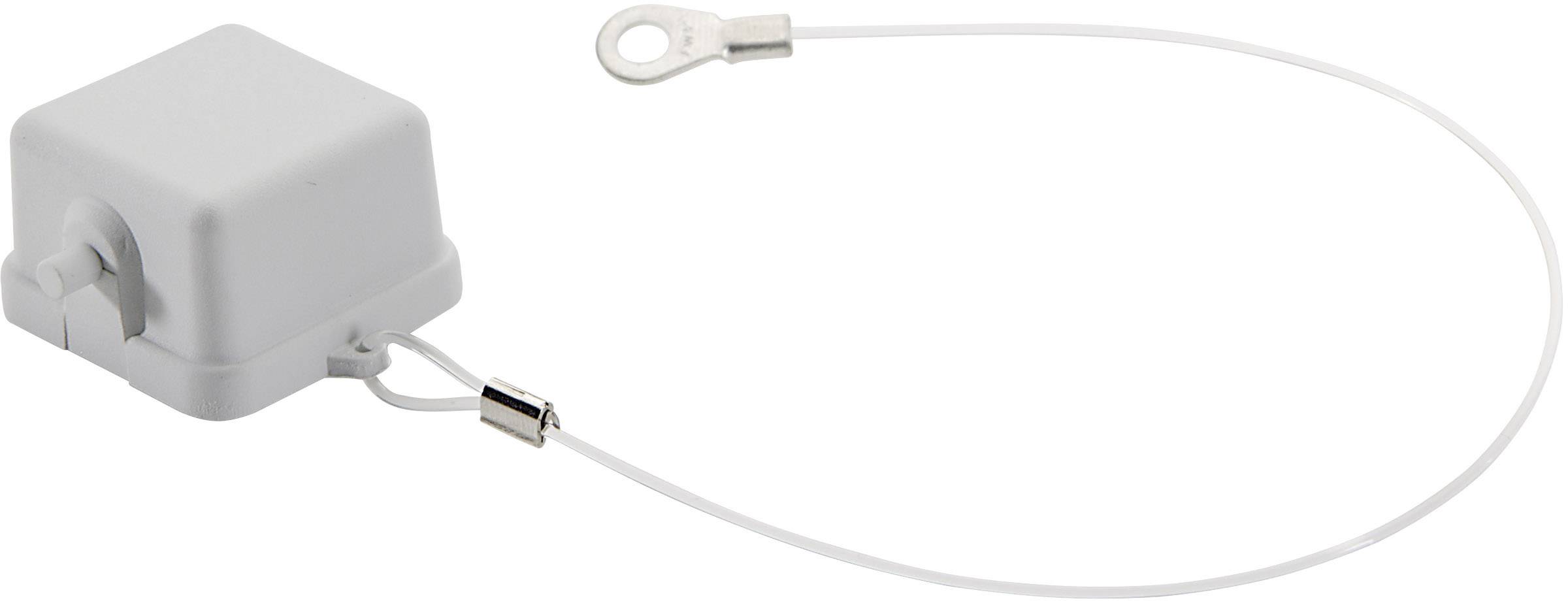 Un objet blanc et carré muni d'un câble et d'un anneau métallique. Il semble s'agir d'un raccordement électrique ou technique.