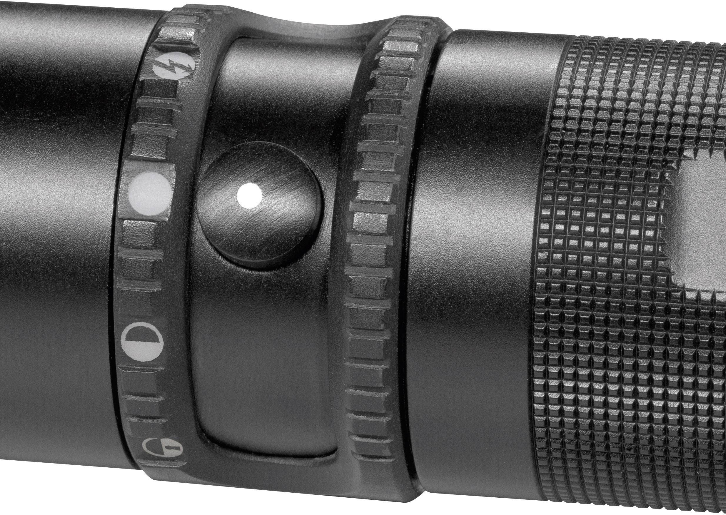 'Gros plan d'un interrupteur de lampe de poche noir avec des symboles de réglage pour différents modes.'