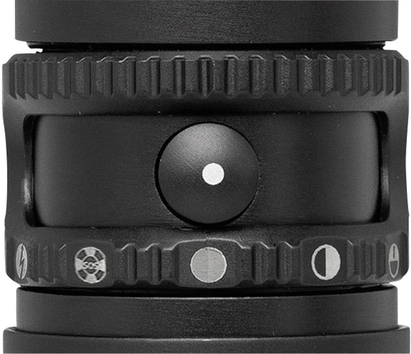 Gros plan d'un bouton noir avec plusieurs symboles de contrôle des fonctions. Caractéristique principale : indicateur de point.