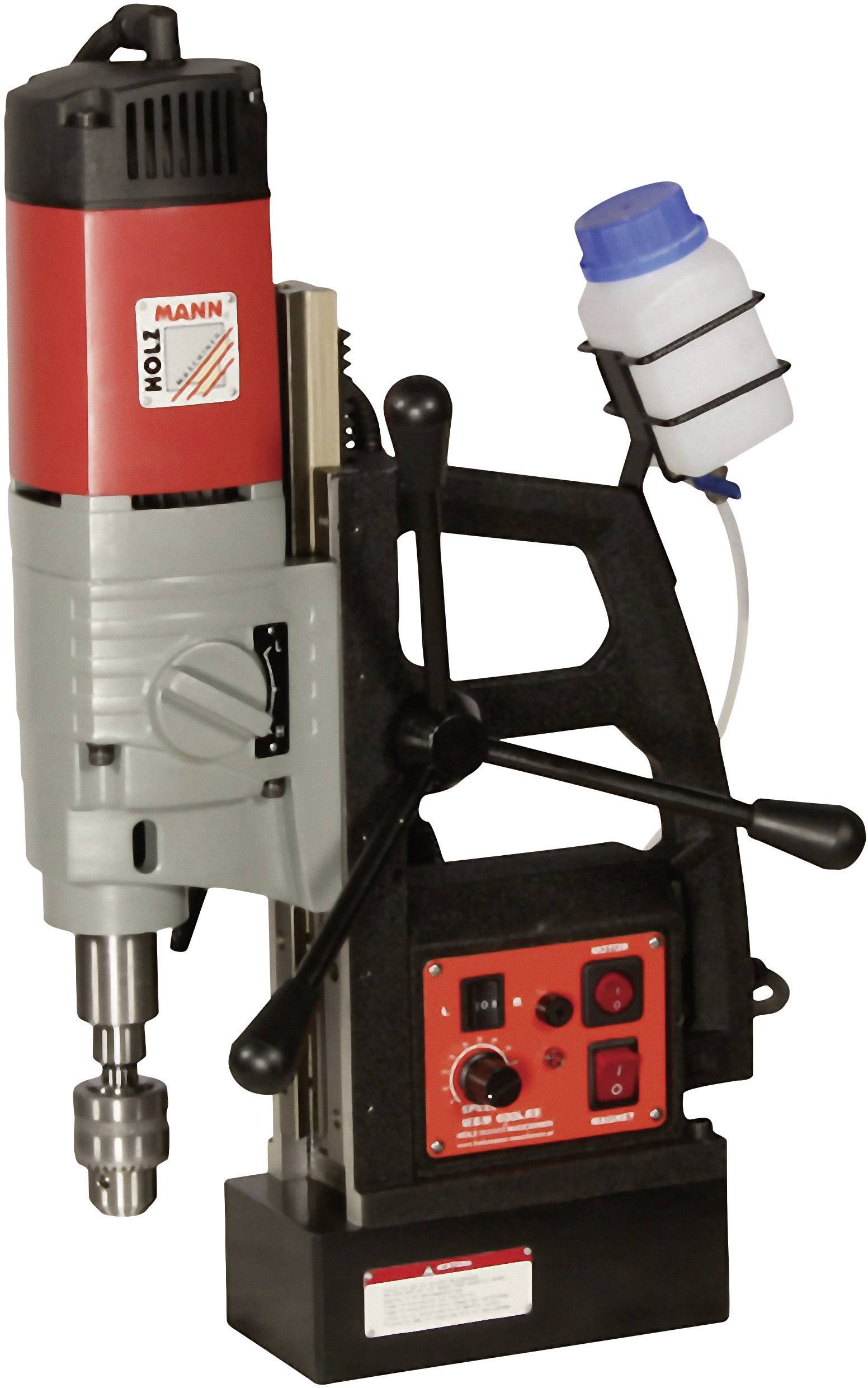 Une perceuse magnétique avec un boîtier rouge et un socle noir. Interrupteur rotatif et réservoir de liquide de refroidissement visibles.
