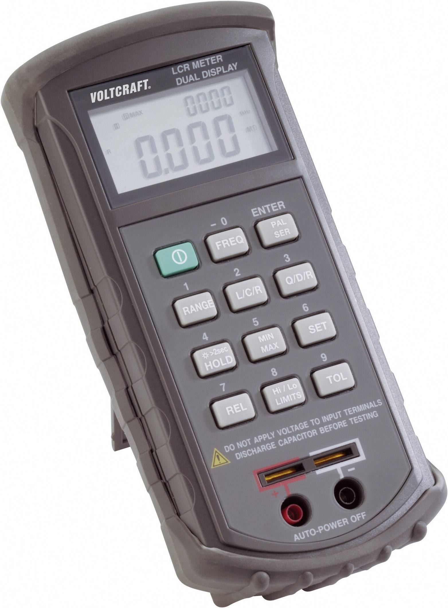 Appareil portable de mesure LCR à deux affichages, montrant une mesure zéro. Touches de réglage des fonctions. Indication pour éviter les tensions.