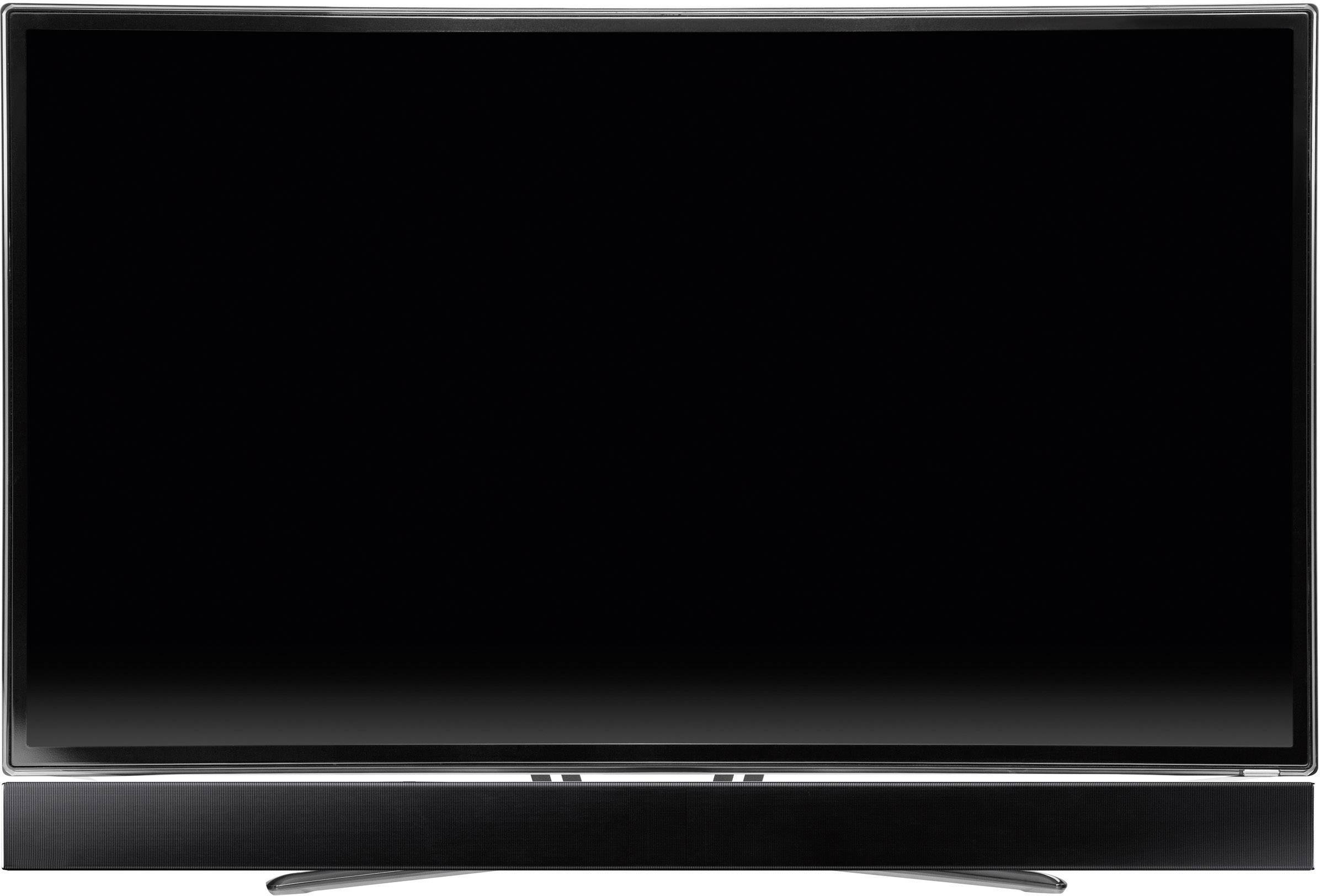 Un téléviseur à écran plat noir éteint est posé sur une table. L'écran est sombre et le cadre est de couleur argent.