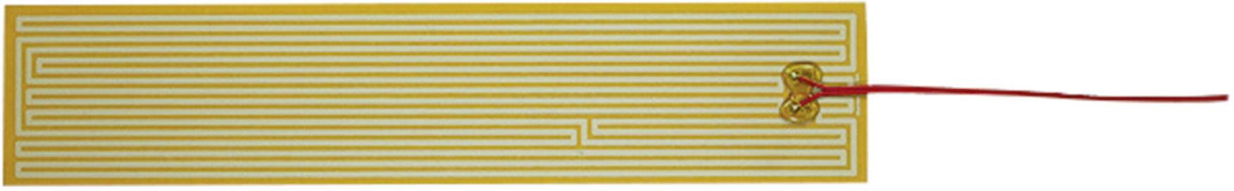 Un élément chauffant rectangulaire avec des lignes blanches sur un fond jaune. Un câble rouge est connecté en haut à droite.