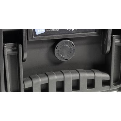 Poignée d'une valise à coque dure équipée d'une soupape de ventilation au centre, portant l'inscription « AUTO PRESSURE EQUALIZATION ».