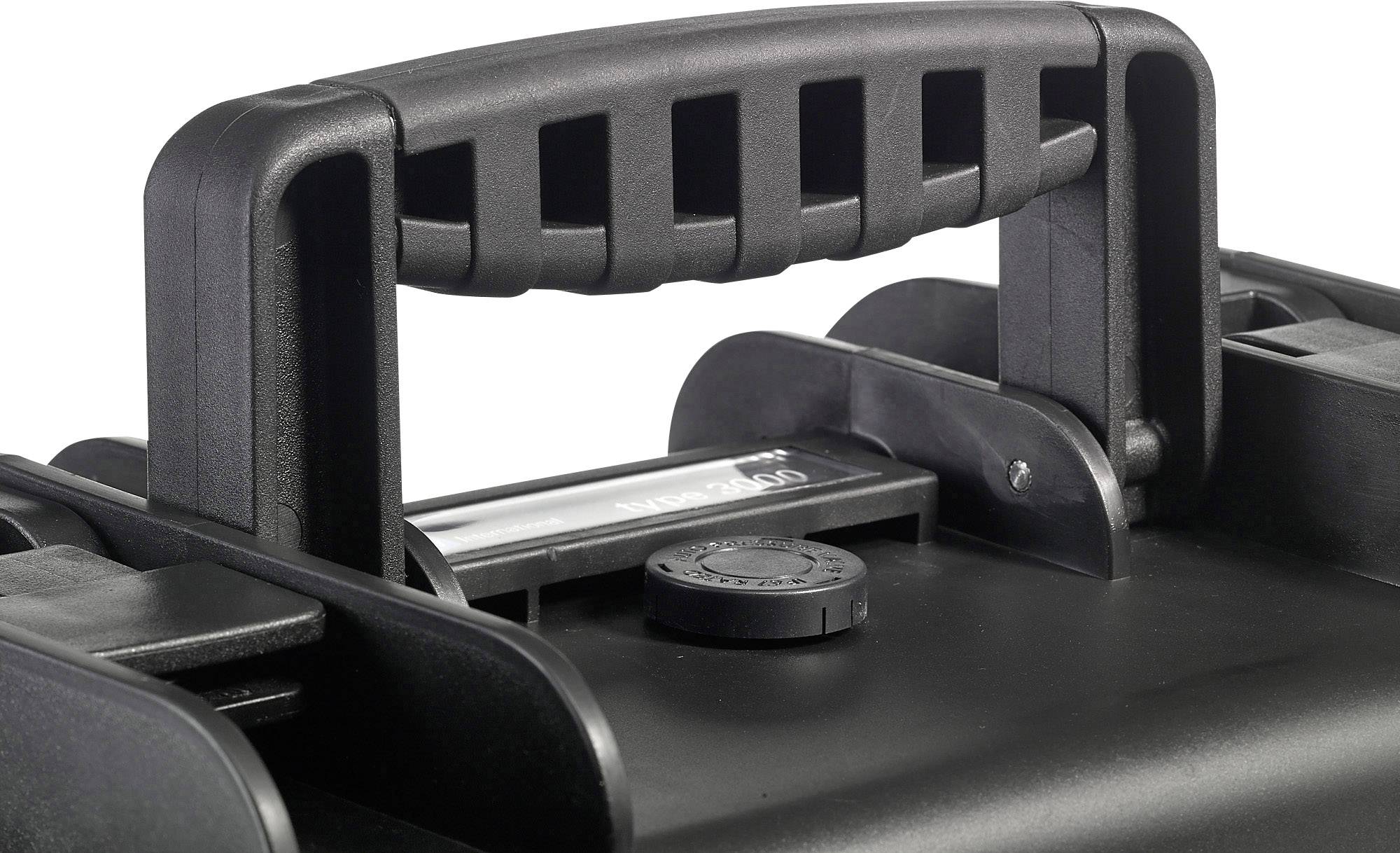 Une poignée noire et robuste d'une valise avec un bouton de fermeture en dessous, adaptée pour un transport en toute sécurité.