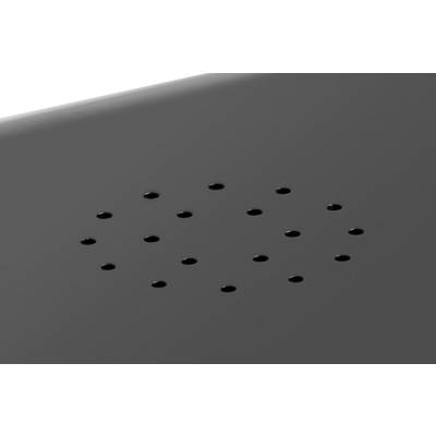 Surface noire avec un arrangement précis de petits trous disposés en cercle