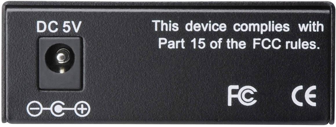 Adaptateur noir portant le texte 'DC 5V' et la mention 'Cet appareil est conforme à la Partie 15 des règles de la FCC.' avec les symboles CE et FCC.