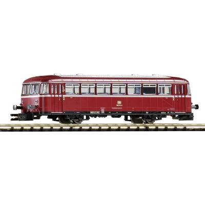 Train modèle rouge de la Deutsche Bundesbahn sur une voie ferrée. Le train possède de nombreuses fenêtres et est conçu dans le style d'un ancien autorail.