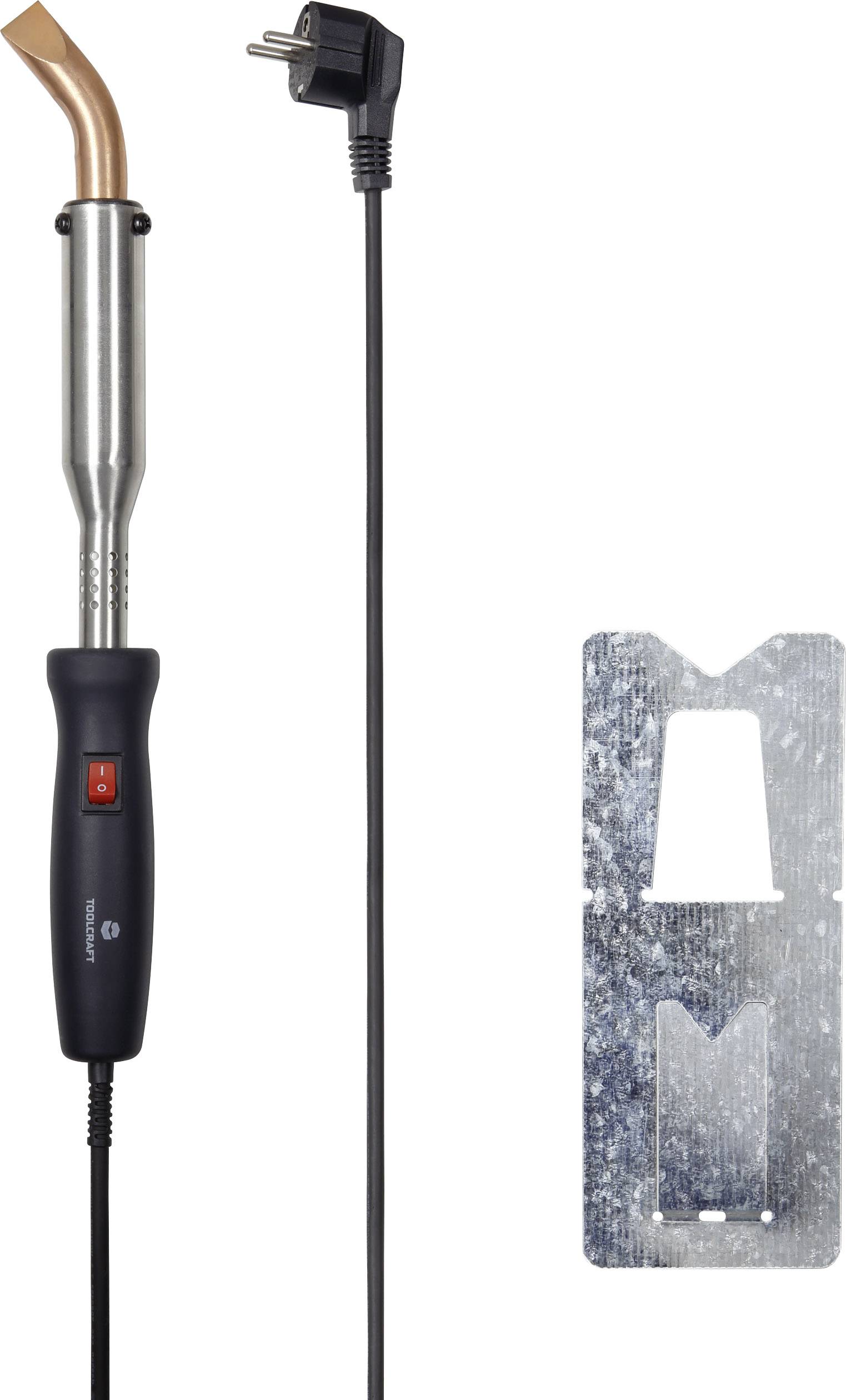 Appareil de chauffage électrique avec un long câble, une buse en cuivre et un interrupteur sur la poignée. À côté, un support métallique.