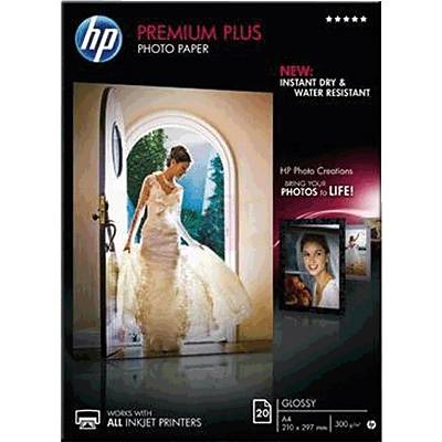 Femme en robe de mariée debout dans une porte ouverte. Texte : 'HP Premium Plus Papier Photo' et 'Donnez vie à vos photos !'