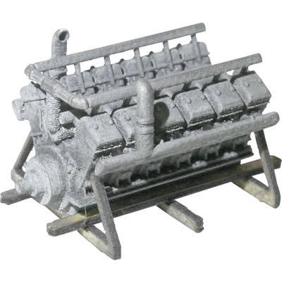 Miniature grise d'un moteur V12, conçue avec détail, montrant des cylindres et des tubes visibles sur un support métallique.