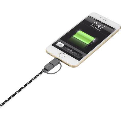 Un smartphone est en train de se recharger, un câble est branché. L'écran affiche une jauge de batterie verte et l'heure 2:47.