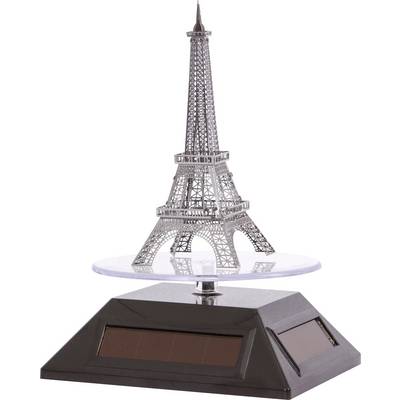 Modèle miniature de la Tour Eiffel sur un socle noir avec des panneaux solaires, présenté sur une plateforme transparente.