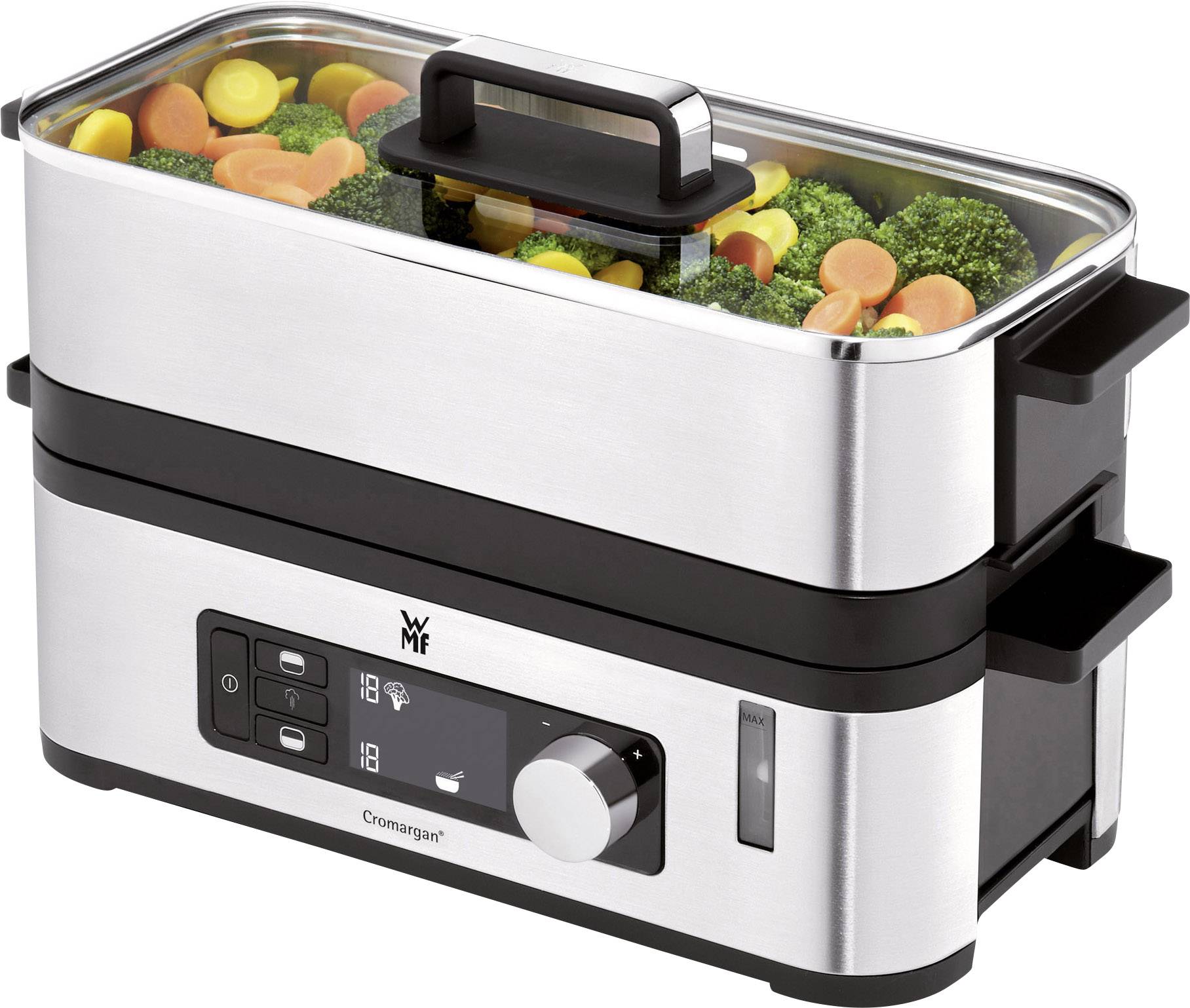 Un cuiseur vapeur en acier inoxydable avec affichage numérique. Dans le compartiment supérieur se trouvent du brocoli, des carottes et d'autres légumes à faire cuire à la vapeur.