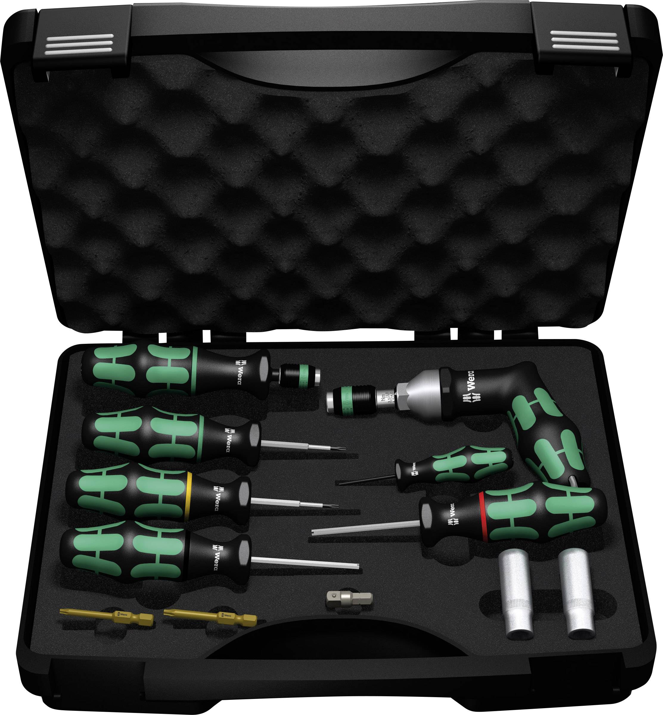 Mallette à outils avec tournevis et embouts de différentes tailles. Poignées en noir et vert ; idéal pour les travaux de bricolage.