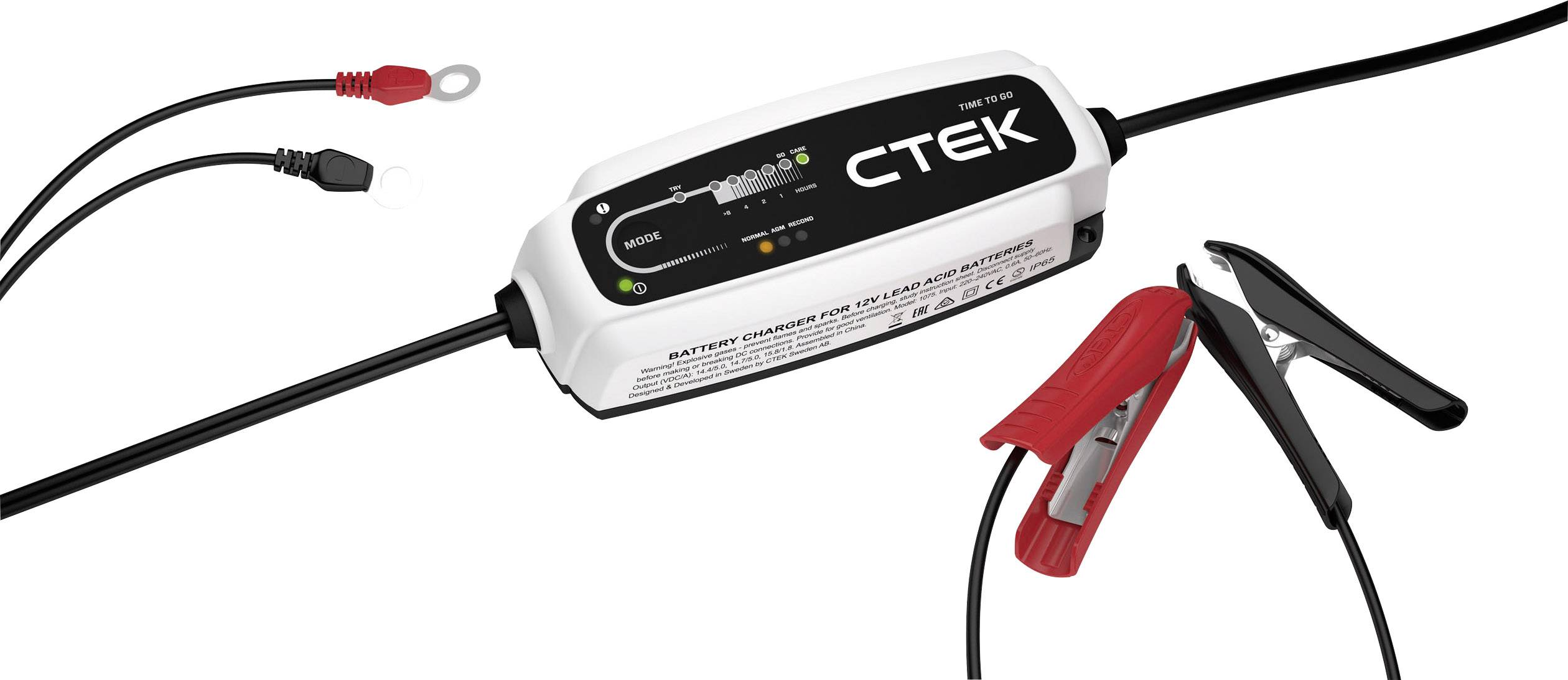 Chargeur de batterie avec pinces et câbles de charge, affichage LCD indiquant la progression de la charge. Adapté aux batteries de voiture 12V, design compact.