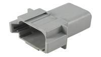 Un connecteur en plastique gris de forme rectangulaire avec plusieurs contacts de branchement.
