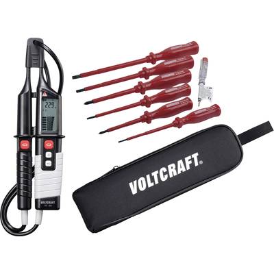 Un ensemble de multimètre comprenant un appareil numérique de mesure de tension, six tournevis rouges et un étui noir portant le logo 'Voltcraft'.