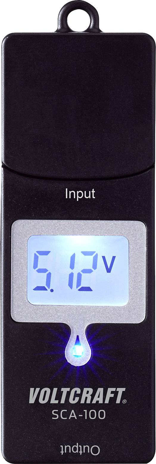 Appareil de mesure de tension avec écran bleu affichant '5,12V'. Étiqueté 'Input' en haut et 'Output' en bas. Marque : Voltcraft SCA-100.