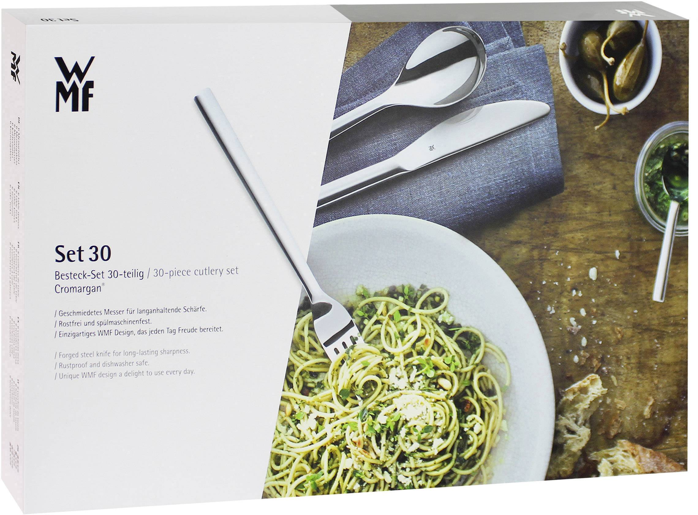 Emballage d'un service de couverts WMF en 30 pièces, avec une fourchette, un couteau et une cuillère illustrés. Une assiette de spaghettis avec sauce à côté.