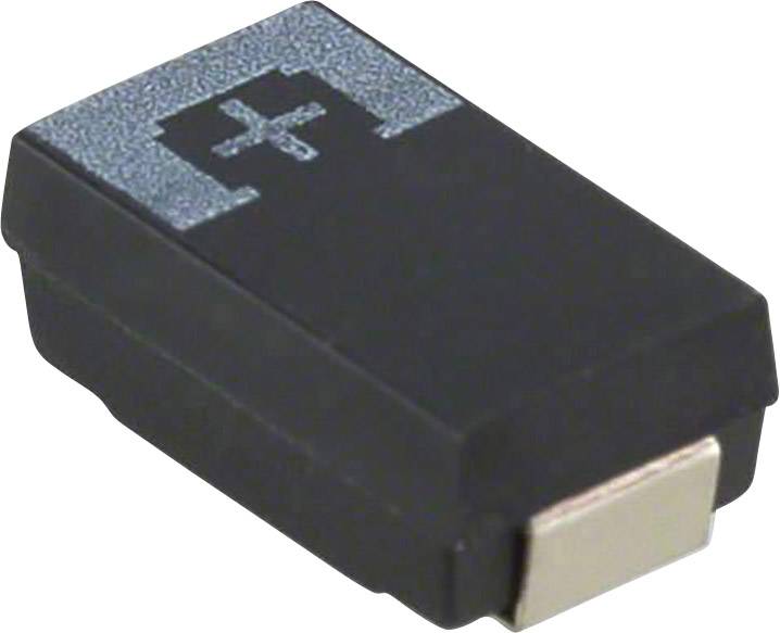 Un composant électronique noir, probablement un semi-conducteur, avec un symbole de croix blanche en haut, sur une surface blanche.