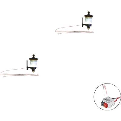 Deux mini-lampadaires avec des câbles sont visibles. En bas à droite se trouve un interrupteur qui semble permettre de commander les lampes.