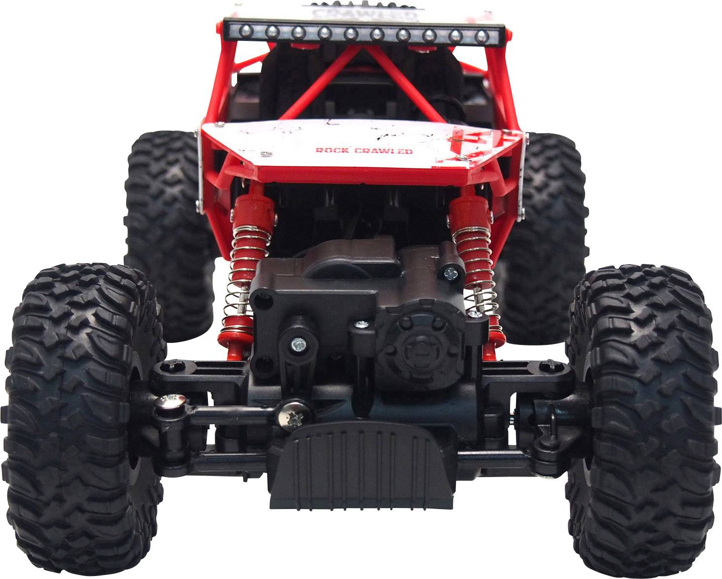 Véhicule tout-terrain rouge avec de grandes roues et suspensions, photographié de face. Design conçu pour des aventures robustes en terrain difficile.