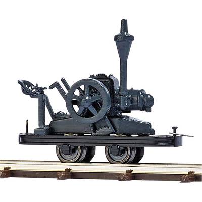 Ancien modèle de locomotive à vapeur sur des rails, présentant un design antique avec de grandes roues et une cheminée.