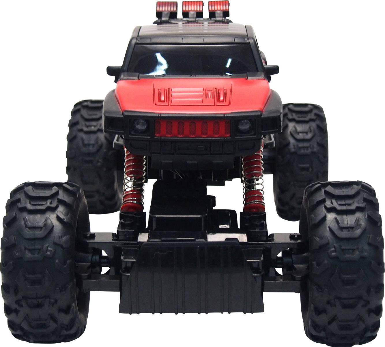 Un monster truck télécommandé noir et rouge avec de grandes roues et des amortisseurs, photographié de face.