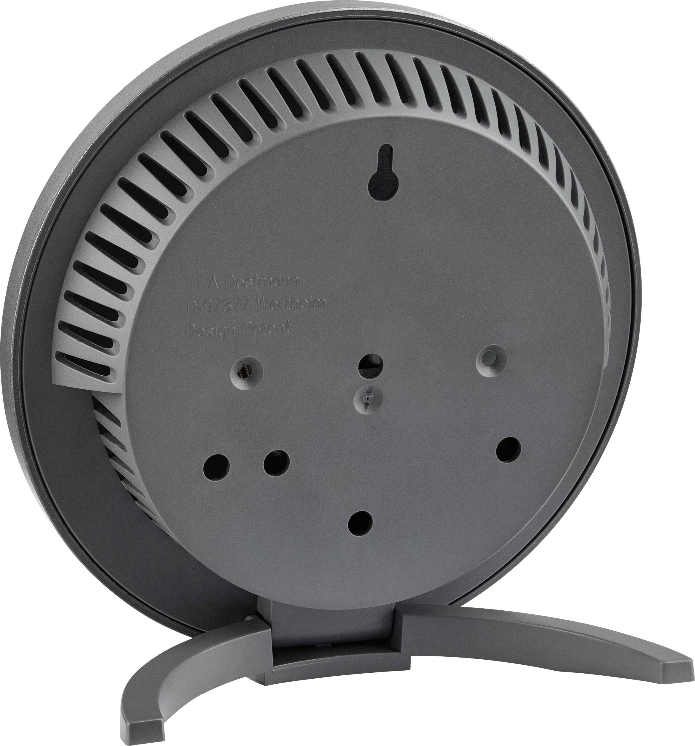 Un radiateur soufflant gris vu de dos, avec des ouvertures de ventilation et un socle de support. Aucune indication de marque ou de modèle n'est visible.