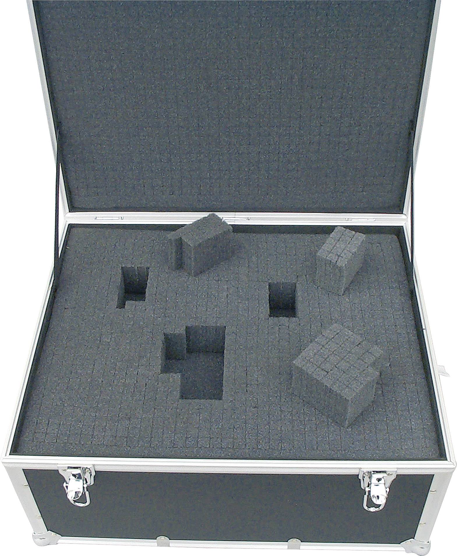 Une valise ouverte avec un intérieur en mousse qui permet des adaptations pour différents appareils. Des cavités carrées sont visibles.