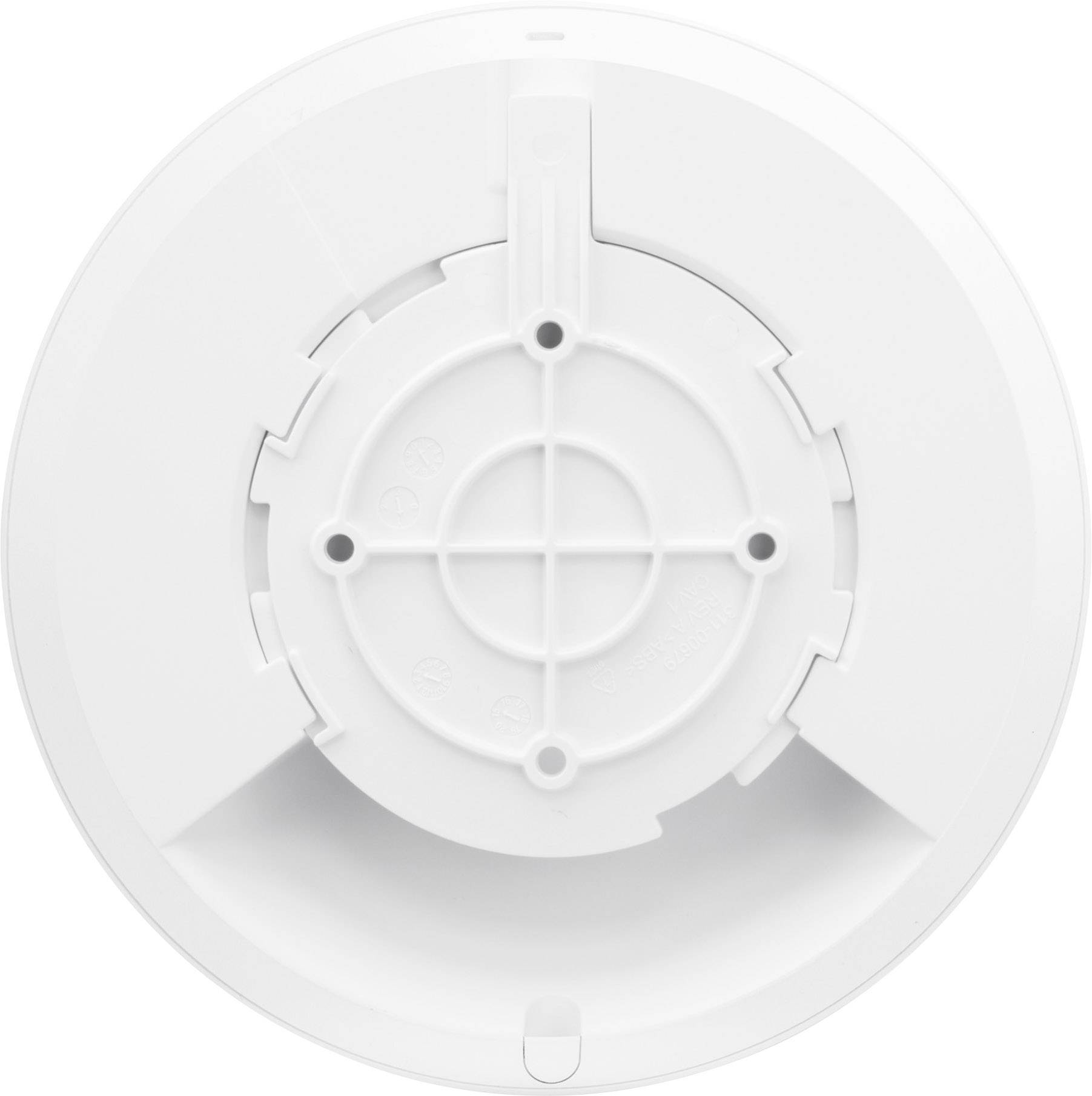 Un couvercle blanc, rond, avec un support central et des fentes symétriques, probablement un composant d'un dispositif technique.
