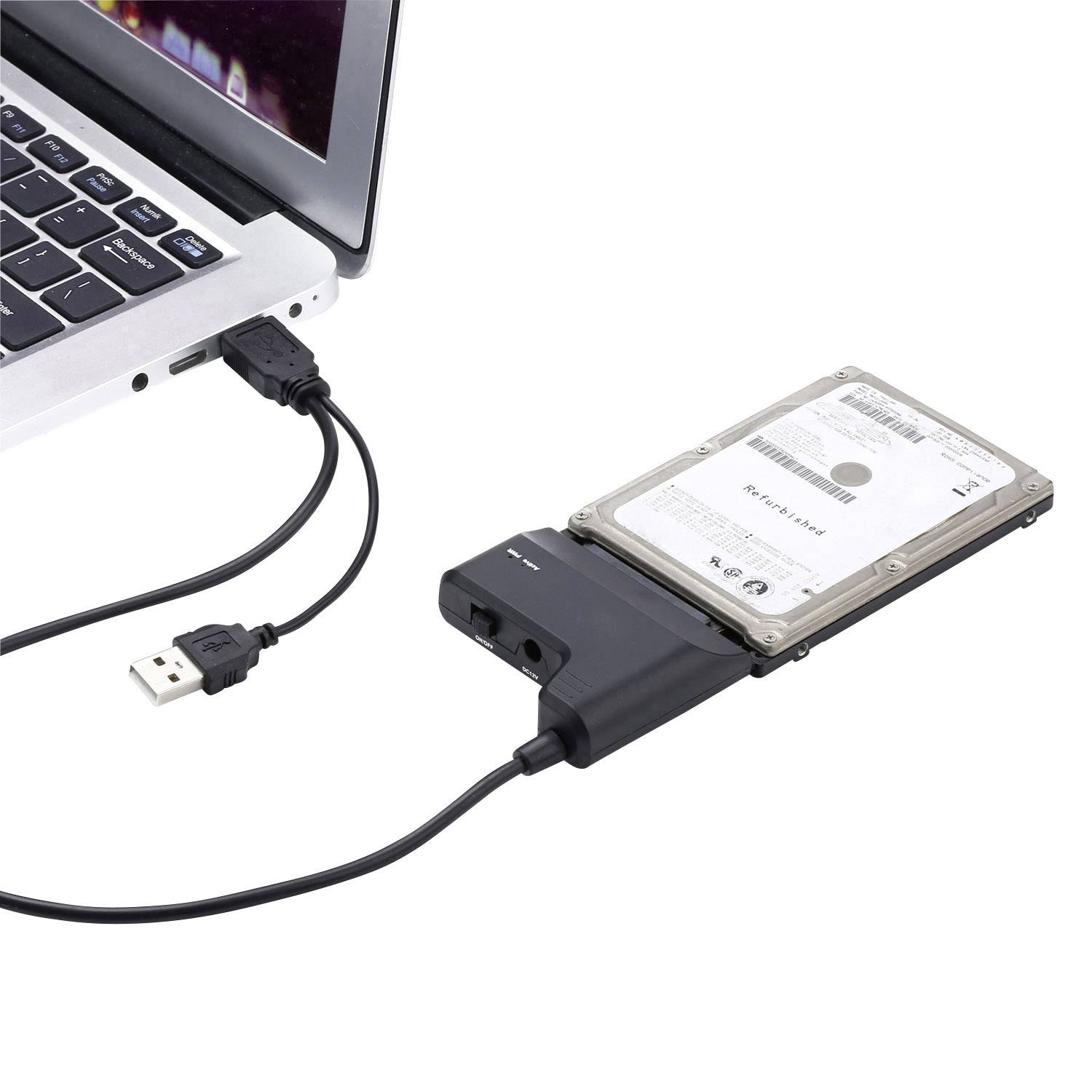 Ordinateur portable externe avec adaptateur connecté et disque dur externe. Un câble USB relie le disque dur à l'adaptateur.