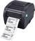 Imprimante d'étiquettes TSC en cours d'impression ; des étiquettes avec des codes QR et le texte 'Product: Product Label Printer' sont en train d'être imprimées.