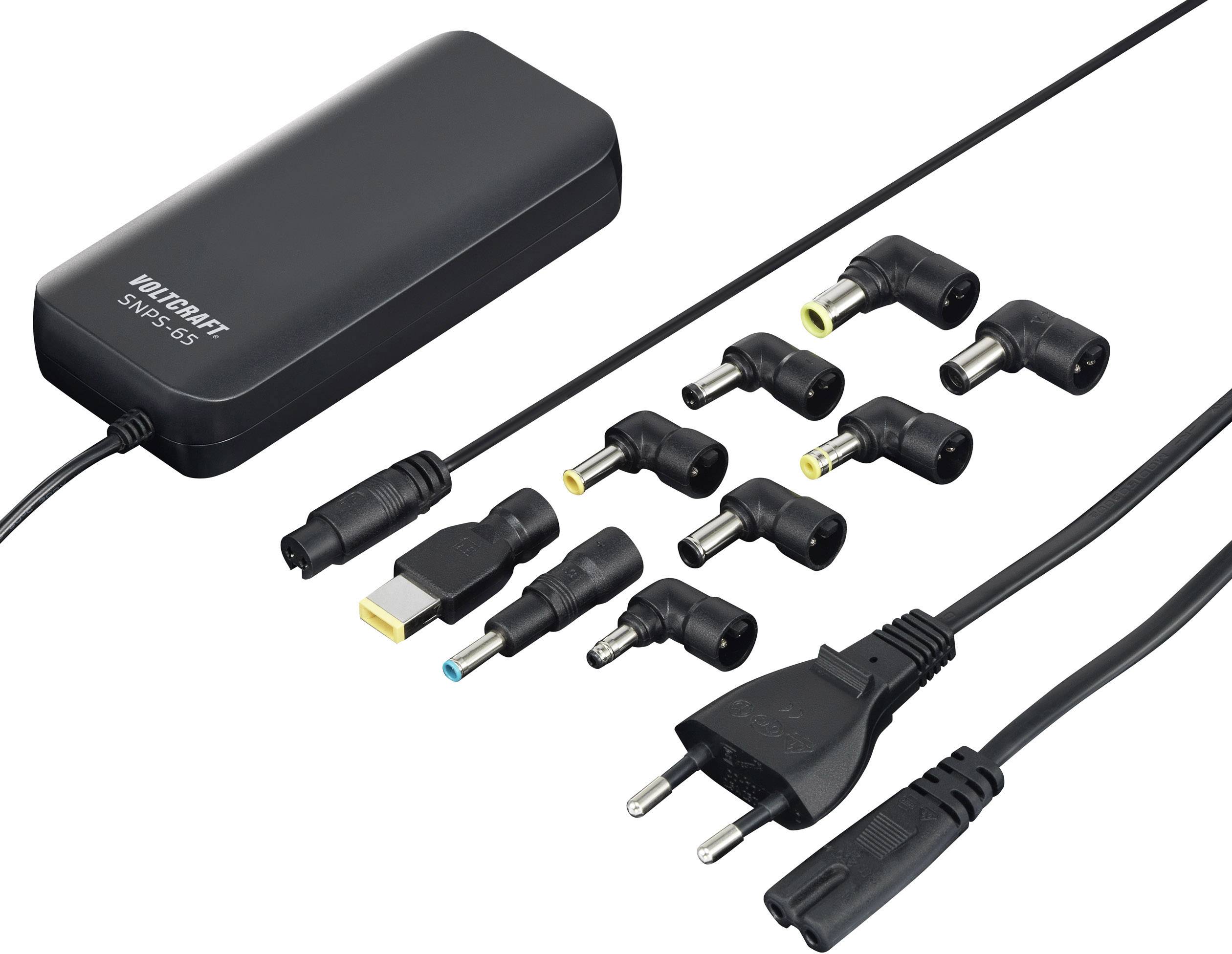 Un chargeur universel noir pour ordinateur portable avec dix fiches différentes et une fiche européenne. Adapté à différents modèles d'ordinateurs portables.