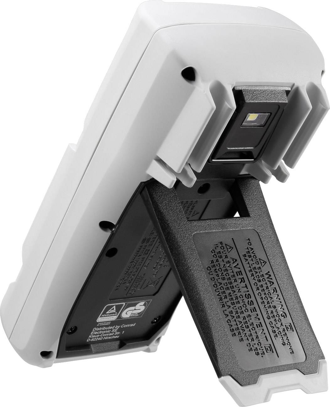 Un appareil de mesure numérique avec un compartiment de batterie ouvert. Des avertissements sont visibles, ainsi que l'arrière de l'appareil.